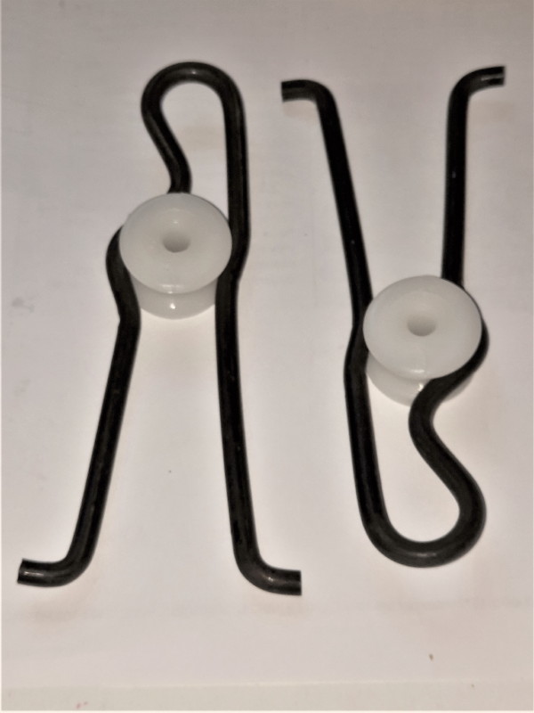 Ovenavausrajoitin ja rulla